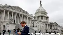 WASHINGTON, DC - SEPTEMBER 29: Rep. Dean Phillips (D-MN) looks at his phone as he leaves the U.S. Capitol Building on September 29, 2023 in Washington, DC. The House of Representatives failed to pass a temporary funding bill to avert a government shutdown, with 21 Republicans joining Democrats in defiance of U.S. Speaker of the House Kevin McCarthy (R-CA). (Photo by Anna Moneymaker/Getty Images)