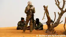 14/03/2020**Militants from the Movement for the Salvation of Azawad (MSA), a Tuareg political and armed movement in the Azawad Region in Mali, rest in the desert outside Menaka on March 14, 2020 while on patrol. (Photo by Souleymane Ag Anara / AFP)