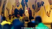 In this photo provided by Iranian Students' News Agency, ISNA, members of Saudi Arabia's Al Ittihad soccer team leave Naghsh-e-Jahan stadium in the central city of Isfahan, Iran, Monday, Oct. 2, 2023. Al Ittihad refused to play a match in Iran on Monday because of the presence of a statue of a slain Iranian general Qassem Soleimani placed on the sideline, Saudi state media reported. (Behrouz Naderi, ISNA via AP)