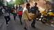 Security officers carry boxes of material confiscated after a raid at the office of NewsClick in New Delhi, India Security officers carry boxes of material confiscated after a raid at the office of NewsClick in New Delhi, India