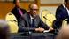 Rwanda's President Paul Kagame gestures as he sits at a desk with a microphone in front of him Rwanda's President Paul Kagame gestures as he sits at a desk with a microphone in front of him
