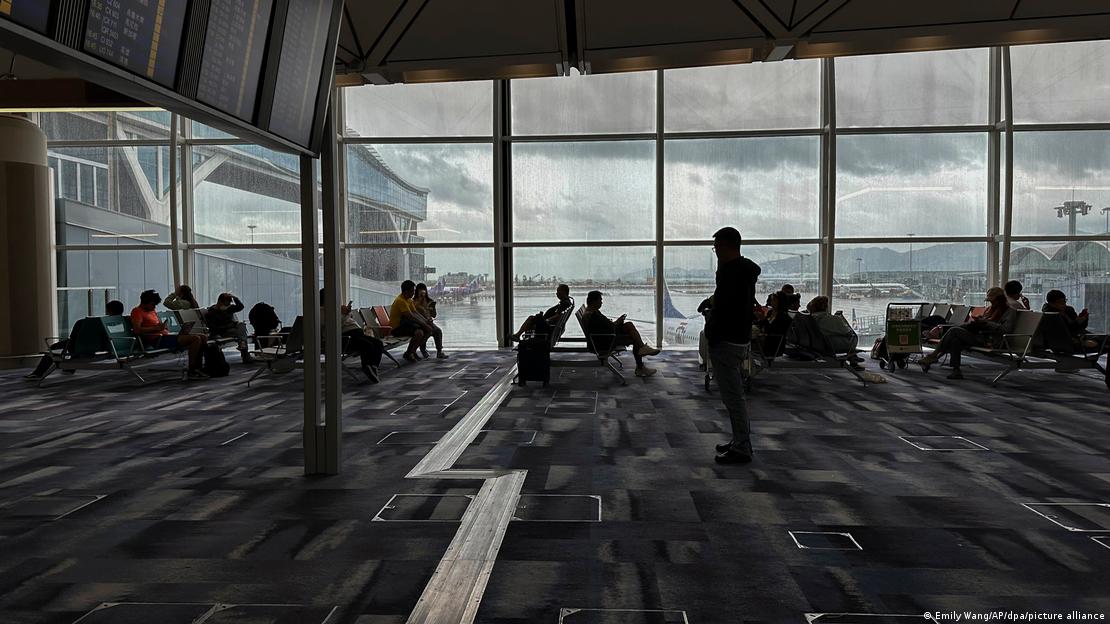 Passengers waiting at an airport in Hong Kong