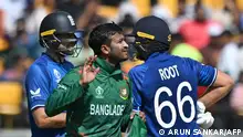 Bangladesh's captain Shakib Al Hasan (C) gestures past England's Joe Root (R) and Dawid Malan during the 2023 ICC Men's Cricket World Cup one-day international (ODI) match between England and Bangladesh at the Himachal Pradesh Cricket Association Stadium in Dharamsala on October 10, 2023. (Photo by ARUN SANKAR / AFP) / -- IMAGE RESTRICTED TO EDITORIAL USE - STRICTLY NO COMMERCIAL USE --