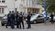 French police officers stand in front of the Gambetta high school in Arras