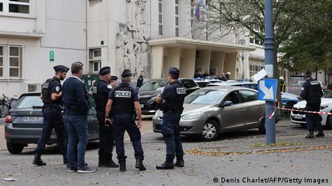 French police officers stand in front of the Gambetta high school in Arras