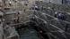 A youth jumps into the historic Chand Baori stepwell as others look on in Abhaneri village in Rajasthan, India A youth jumps into the historic Chand Baori stepwell as others look on in Abhaneri village in Rajasthan, India