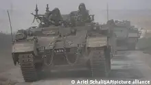 A convoy of Israeli armoured personnel carriers (APC) head towards the Gaza Strip border in southern Israel on Saturday, Oct. 14, 2023. (AP Photo/Ariel Schalit)
