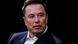 Elon Musk musk looking to his left while sitting in front of a black background Elon Musk musk looking to his left while sitting in front of a black background