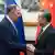 Lavrov shakes hands with Wang
