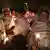 People in Tigray walk with candles to mourn their lost sons 