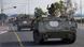 An Israeli soldier flashes a V-sign from an armoured personnel carrier (APC) convoy as they head towards the Gaza Strip border An Israeli soldier flashes a V-sign from an armoured personnel carrier (APC) convoy as they head towards the Gaza Strip border