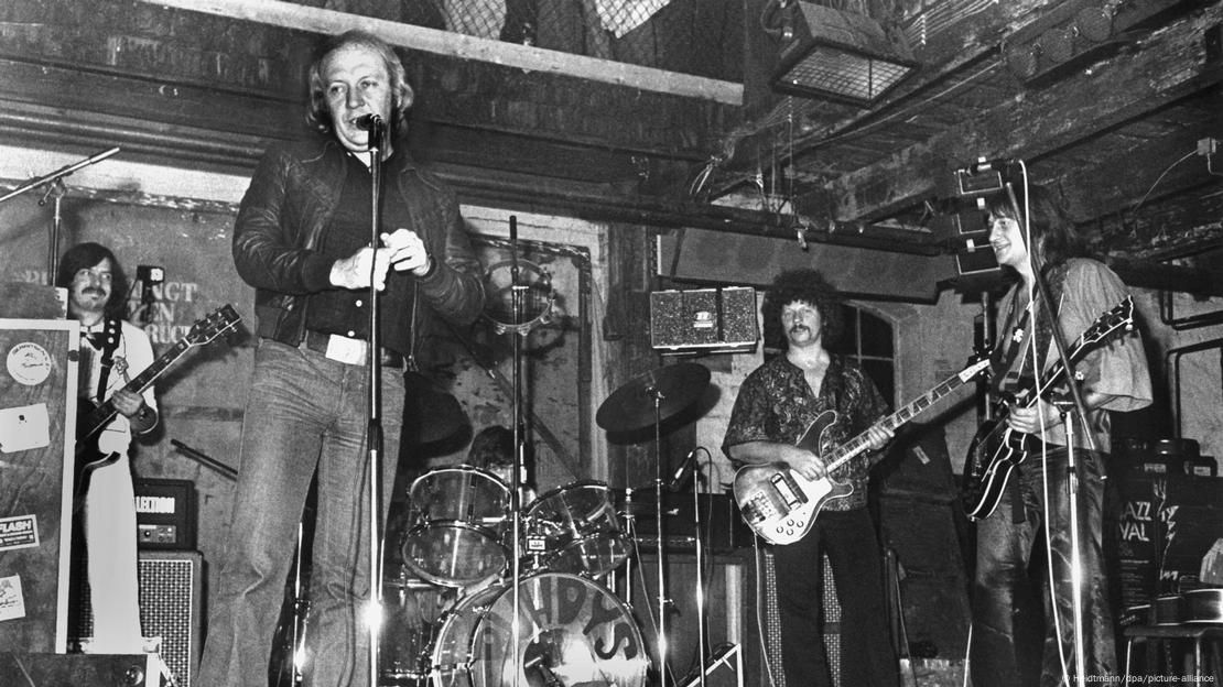 In a black-and-white photo from November 10, 1979, the four members of the East German rock band the Puhdys perform onstage in Hamburg.