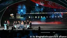 18.10.2023
(231019) -- CHENGDU, Oct. 19, 2023 (Xinhua) -- This photo taken on Oct. 18, 2023 shows a scene of the opening ceremony of the 81st World Science Fiction Convention (WorldCon) in Chengdu, southwest China's Sichuan Province. The 81st WorldCon opened here on Wednesday. Chengdu is the second city in Asia and the first in China to host the convention. Themed Meet the Future, Chengdu WorldCon will highlight the symbiotic relationship between science fiction and the city, presenting over 200 activities, panels and salons, the Hugo Awards, and themed exhibitions occupying an area of 5,000 square meters. Famous sci-fi writers from around the world, including Hugo Award winners Liu Cixin and Robert J. Sawyer, are attending the five-day event, sharing their knowledge of new technology and their visions of a new world. (Xinhua/Xu Bingjie)