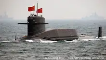 FILE - In this April 23, 2009 file photo, a Chinese Navy nuclear-powered submarine sails during an international fleet review in the waters off Qingdao, China, to celebrate the 60th anniversary of the founding of People's Liberation Army Navy. Nearly every Asian country with a coastline is fortifying its submarine fleet amid territorial disputes stirred up by an increasingly assertive China and the promise of bountiful natural resources in the Pacific. (AP Photo/Guang Niu, Pool, File)