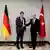 Turkish economic minister Simsek (r) shakes the hand of German economic minister Habeck (l)