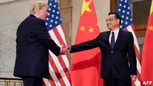 09/11/2017**(FILES) US President Donald Trump (L) shakes hands with Chinese Premier Li Keqiang during a meeting at the Great Hall of the People in Beijing on November 9, 2017. Former Chinese premier Li Keqiang has died after suffering a heart attack, state media reported on October 27, 2023. (Photo by JIM WATSON / AFP)