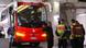 People standing around the damaged Lyon team bus People standing around the damaged Lyon team bus