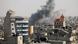 Smoke rises amid buildings in Gaza following an Israeli strike Smoke rises amid buildings in Gaza following an Israeli strike