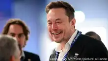 Tesla and SpaceX's CEO Elon Musk, right, speaks with other delegates during the first plenary session on of the AI Safety Summit at Bletchley Park, on Wednesday, Nov. 1, 2023 in Bletchley, England. Digital officials, tech company bosses and researchers are converging Wednesday at a former codebreaking spy base near London to discuss and better understand the extreme risks posed by cutting-edge artificial intelligence. (Leon Neal/Pool Photo via AP)