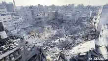 01/11/2023**This image grab taken from AFPTV video footage shows Palestinians checking the destruction in the aftermath of an Israeli strike on the Jabalia refugee camp in the Gaza Strip, on November 1, 2023, amid ongoing battles between Israel and the Palestinian Hamas movement. Thousands of civilians, both Palestinians and Israelis, have died since October 7, 2023, after Palestinian Hamas militants based in the Gaza Strip entered southern Israel in an unprecedented attack triggering a war declared by Israel on Hamas with retaliatory bombings on Gaza. (Photo by AFP)