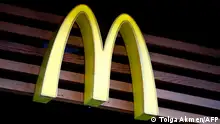 A logo of US burger chain McDonalds is pictured above a branch of the fast food restaurant in central London on September 4, 2017.
McDonald's staff have gone on strike for the first time in Britain in two of the chain's outlets in a dispute over pay and conditions. / AFP PHOTO / Tolga AKMEN (Photo credit should read TOLGA AKMEN/AFP via Getty Images)