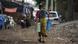 A man carrying water containers A man carrying water containers