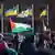 巴勒斯坦权力机构多年来一直悬挂着这面官方旗帜，图为德国柏林一场支持巴勒斯坦的游行