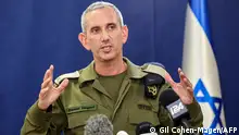 Israeli army spokesman Rear Admiral Daniel Hagari speaks to the press from The Kirya, which houses the Israeli Ministry of Defence, in Tel Aviv on October 18, 2023. A blast ripped through a hospital in war-torn Gaza killing hundreds of people late on October 17, sparking global condemnation and angry protests around the Muslim world. Spokesman Hagari on October 18 said that Israel had evidence that militants were responsible for the blast that killed hundreds at a Gaza hospital, saying a review proved others were at fault. (Photo by GIL COHEN-MAGEN / AFP)