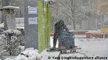 (231106) -- SHENYANG, Nov. 6, 2023 (Xinhua) -- A man delivers packages in snow in Shenyang, northeast China's Liaoning Province, Nov. 6, 2023. A cold front hit Shenyang on Monday, bringing heavy snow to the city. (Xinhua/Yang Qing)