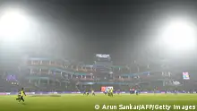06/11/2023**A view of the Arun Jaitley Stadium is pictured amid smoggy conditions in New Delhi on November 6, 2023, during the 2023 ICC Men's Cricket World Cup one-day international (ODI) match between Bangladesh and Sri Lanka. The smog-choked Indian capital was ranked as the planet's most polluted major city on November 6, 2023, but the love of the game trumped health worries for fans at the cricket World Cup. (Photo by ARUN SANKAR / AFP) / -- IMAGE RESTRICTED TO EDITORIAL USE - STRICTLY NO COMMERCIAL USE -- (Photo by ARUN SANKAR/AFP via Getty Images)