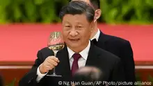 Chinese President Xi Jinping toasts during a dinner reception at the Great Hall of the People on the eve of the National Day holiday in Beijing, Friday, Sept. 30, 2022. (AP Photo/Ng Han Guan)