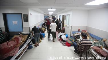 Palestinians injured in Israeli bombardment sleeps on a hospital beds in a ward at Al-Shifa hopsital in Gaza City on November 3, 2023