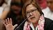 Philippines Senator Leila de Lima raises her hand as she speaks into a microphone Philippines Senator Leila de Lima raises her hand as she speaks into a microphone
