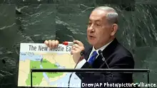 22.9.2023, Israel's Prime Minister Benjamin Netanyahu holds his map of The New Middle East and a red marker pen as he addresses the 78th session of the United Nations General Assembly, Friday, Sept. 22, 2023. (AP Photo/Richard Drew)