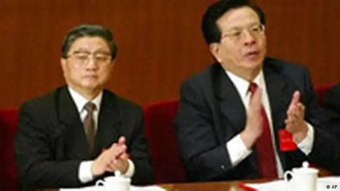 Former Shanghai Party Secretary Huang Ju, left, and Zeng Qinghong, a close aide to President Jiang Zemin, listen to Jiang's speech at the opening session of the Communist Party's 16th National Congress in Beijing's Great Hall of the People Friday, Nov. 8, 2002. Both are rumored to be contenders for senior leadership positions in the Congress under way this week.