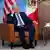 US President Joe Biden (right) and Mexican President Andres Manuel Lopez Obrador (left) at APEC 2023 summit on armchairs and in front of US and Mexican flags