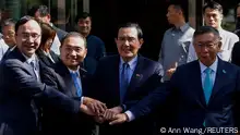 Taiwan's Kuomintang (KMT) Chairman Eric Chu, Hou Yu-ih candidate for Taiwan's presidency from the main opposition party Kuomintang, former Taiwan president Ma Ying-jeou and Taiwan People’s Party Chairman Ko Wen-je hold hands as they pose for a group photo in Taipei, Taiwan November 15, 2023. REUTERS/Ann Wang