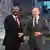 Primeiro-ministro da Etiópia, Abiy Ahmed (à esquerda), foi recebido domingo (19.11), em Berlim, pelo chanceler alemão, Olaf Scholz, antes da cimeira "Compact with Africa" 