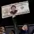Хавьер Милей держит 100-долларовую купюру со своим изображением, 16 ноября 2023 года