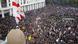 Thousands of protesters in front of the Georgian parliament in Tbilisi and a Georgian flag Thousands of protesters in front of the Georgian parliament in Tbilisi and a Georgian flag