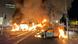 A bus and an automobile ablaze near O'Connell Street in Dublin