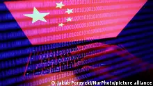 27/09/2022**Flag of China displayed on a laptop screen and binary code displayed on a screen are seen in this multiple exposure illustration photo taken in Krakow, Poland on September 27, 2022. (Photo by Jakub Porzycki/NurPhoto)