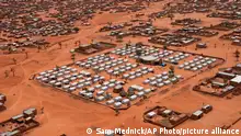 An aerial view shows a camp of internally displaced people in Djibo, Burkina Faso, Thursday May 26, 2022. African leaders have gathered for a summit in Malabo, Equatorial Guinea, to address growing humanitarian needs on the continent, which is also facing increased violent extremism, climate change challenges and a run of military coups. Leaders on Friday called for increased mobilization to resolve a humanitarian crisis that has left millions displaced and more than 280 million suffering from malnourishment. (AP Photo/Sam Mednick)