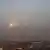 İsrail bombardımanı sonrası Gazze Şeridi'nin güneyinden dumanlar yükselirken Filistinli militanlarca fırlatılan roketler de objektife böyle yansıyor.
