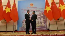(231201) -- HANOI, Dec. 1, 2023 (Xinhua) -- Chinese Foreign Minister Wang Yi (L), also a member of the Political Bureau of the Communist Party of China Central Committee, shakes hands with Vietnamese Foreign Minister Bui Thanh Son during their meeting in Hanoi, Vietnam, on Dec. 1, 2023. (Xinhua/Hu Jiali)