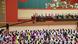 Women listen to North Korean leader Kim Jong Un during the National Mothers Meeting