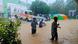 People walk outside the Tambaram Government Hospital flooded following heavy rains along the Bay of Bengal coast in Chennai, India People walk outside the Tambaram Government Hospital flooded following heavy rains along the Bay of Bengal coast in Chennai, India