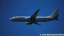 FILE PHOTO: A Boeing P-8 Poseidon aircraft from the U.S. Navy fly during an international aerial and naval military exhibition commemorating the centennial of the Spanish Naval Aviation, over a beach near the naval airbase in Rota, southern Spain, September 16, 2017. REUTERS/Jon Nazca/File Photo