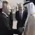United Arab Emirates Foreign Minister Abdullah bin Zayed Al Nahyan, right, greets Russian President Vladimir Putin upon his arrival at an international airport in Abu Dhabi