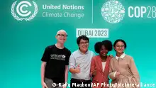 Francisco Vera, from left, Emmanuel Jidisa, Lova Renee and Revan Ahmad pose for a photo at an event to voice children's needs on climate change at the COP28 U.N. Climate Summit, Wednesday, Dec. 6, 2023, in Dubai, United Arab Emirates. (AP Photo/c)